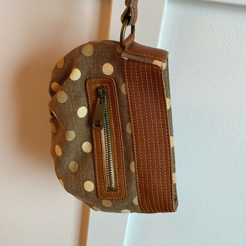 Fossil wristlet with genuine leather accents